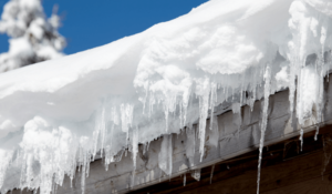 Dangers of Snow on Hail Damage Roof