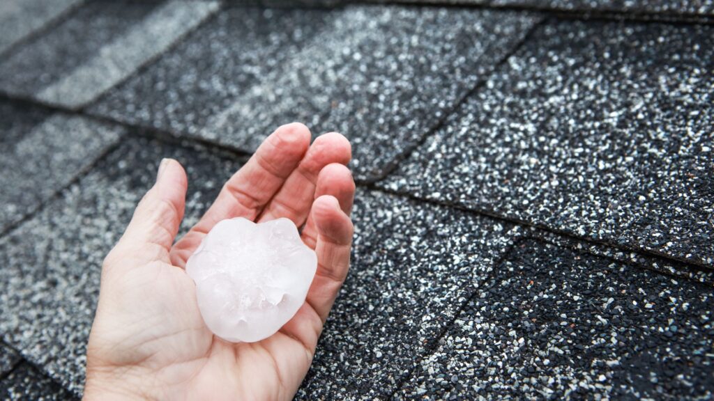 Hailstorm piling up by Peak to Peak Roofing