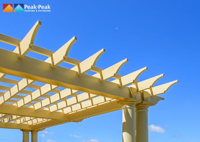 Transform your outdoor living space with custom pergolas from Peak to Peak Roofing. Contact us today to discuss your design project and enhance your patio!
